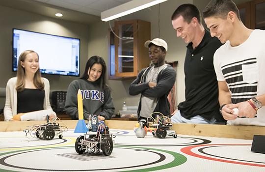undergrad students compete in Robot Olympics